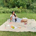 girl sitting out having a picnic