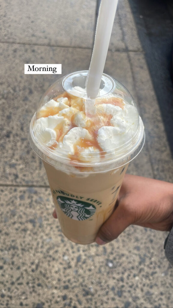 startbucks coffe with whipped cream and caramel drizzled on top